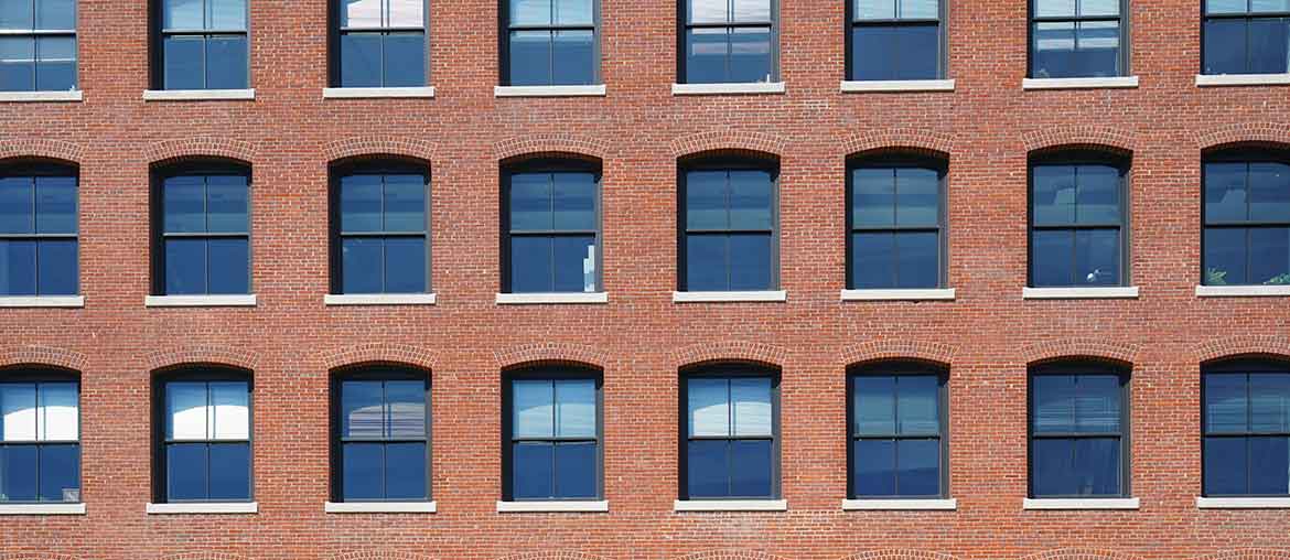 Building with lots of windows that needs insurance
